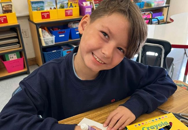 Student creating art at Immaculate Heart of Mary School